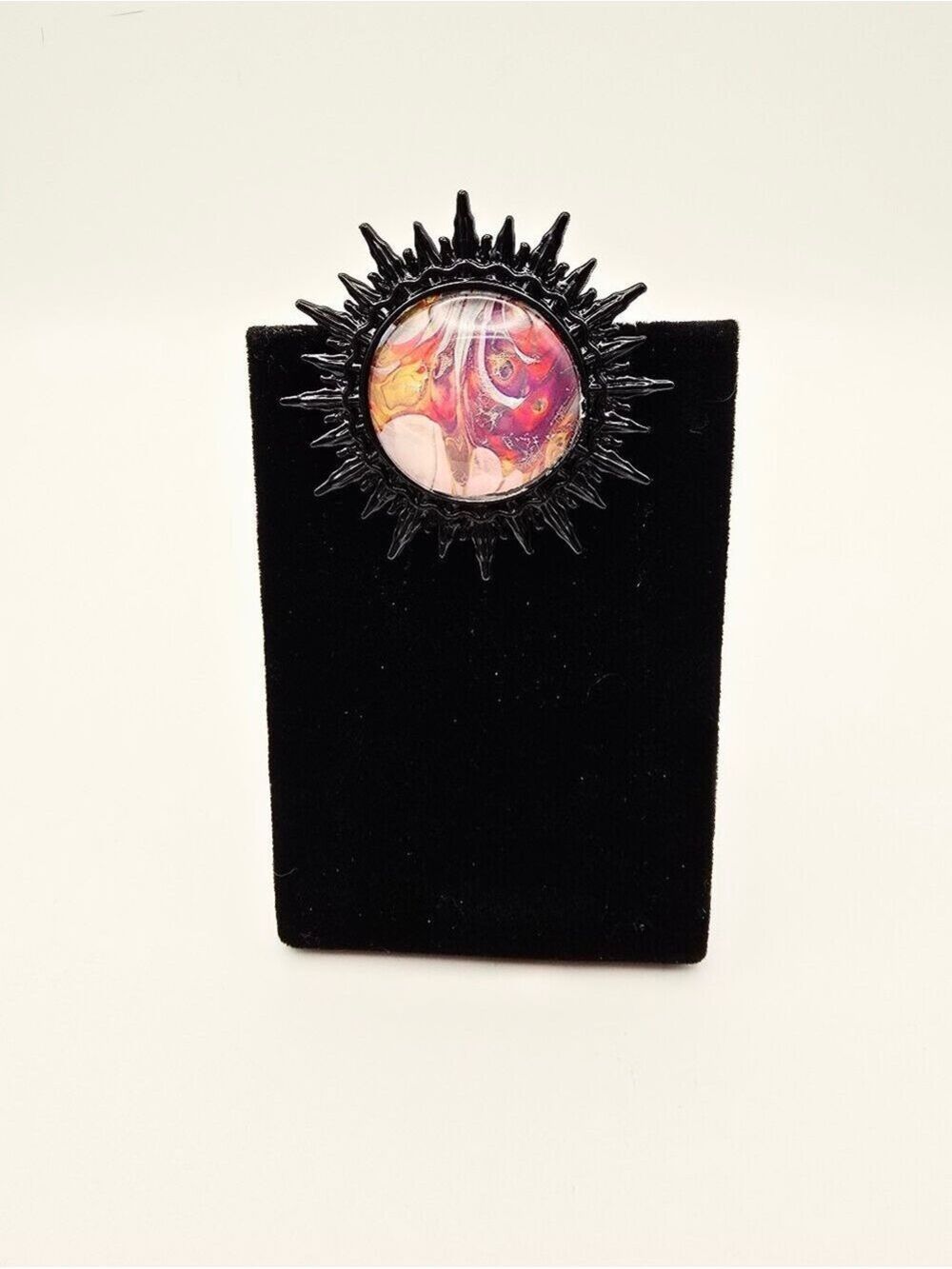 Vibrant Handcrafted Sunburst Pin with Multicolor Center